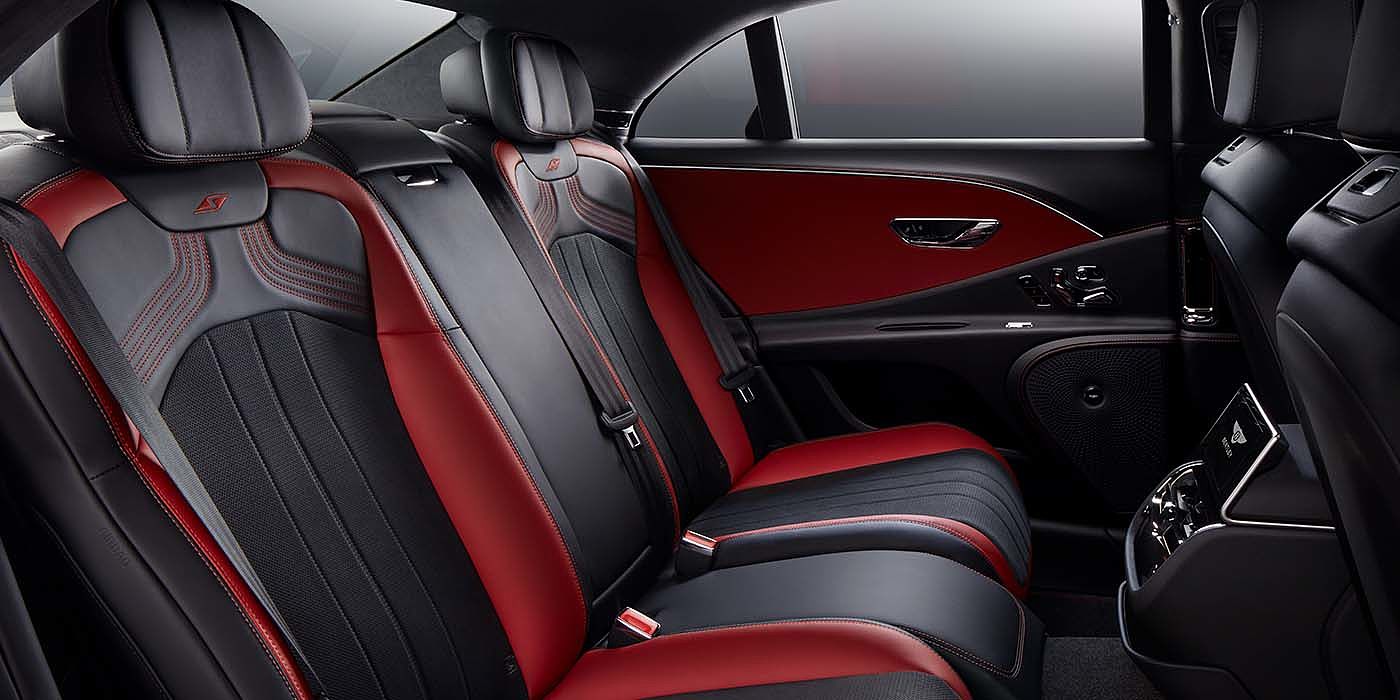 Bentley Warszawa Bentley Flying Spur S sedan rear interior in Beluga black and Hotspur red hide with S stitching