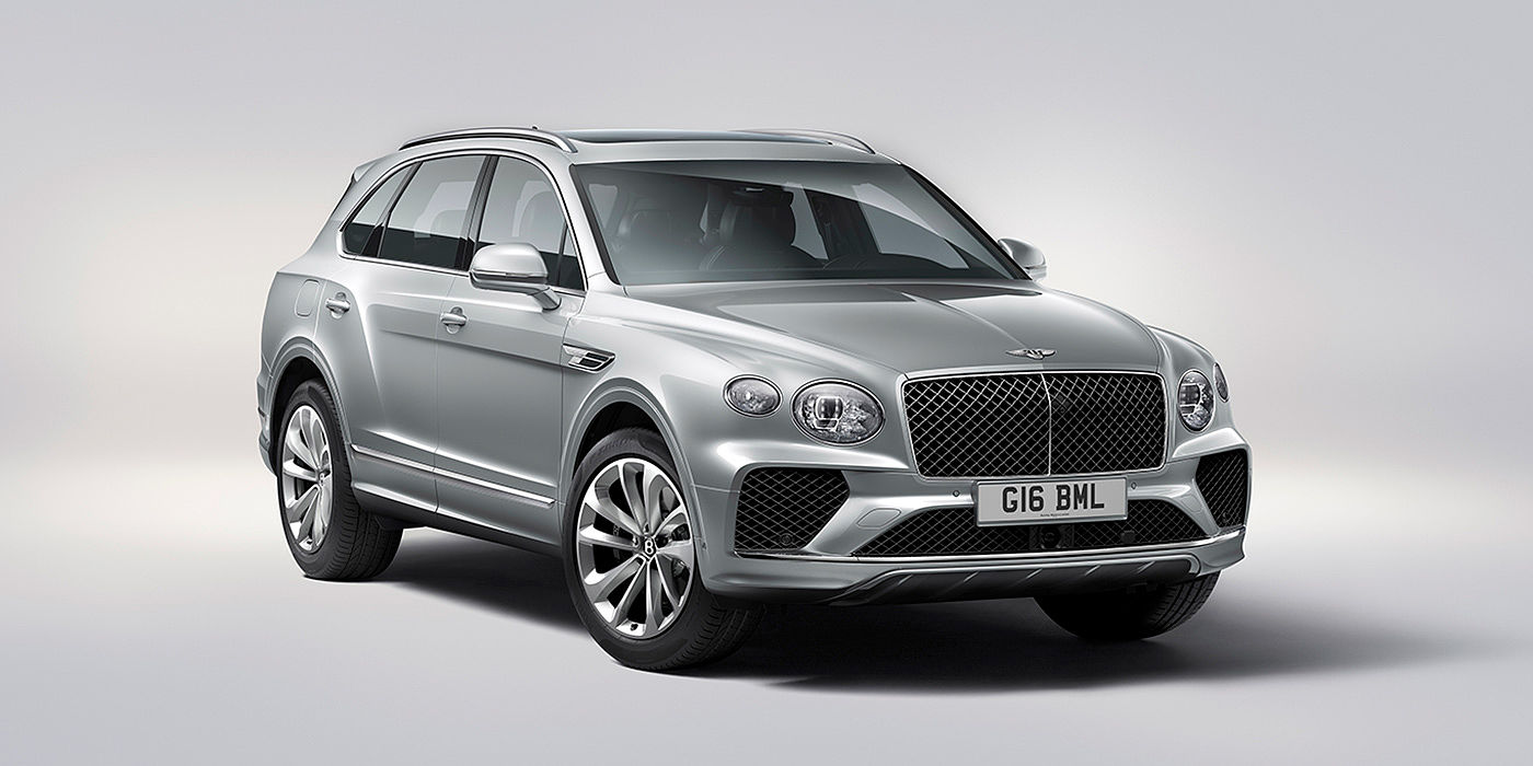 Bentley Warszawa Bentley Bentayga in Moonbeam paint, front three-quarter view, featuring a matrix grille and elliptical LED headlights.