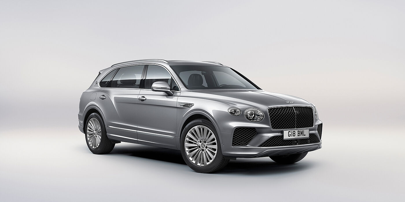 Bentley Warszawa Bentley Bentayga Extended Wheelbase luxury SUV front three quarter view in Moonbeam paint with 21 inch five spoke painted wheels