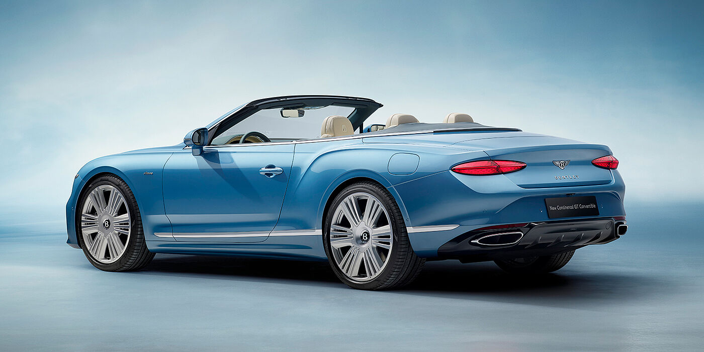 Bentley Warszawa New Bentley Continental GTC Azure convertible rear view in Light Windsor blue paint with 22 inch ten spoke wheels and chrome exterior details