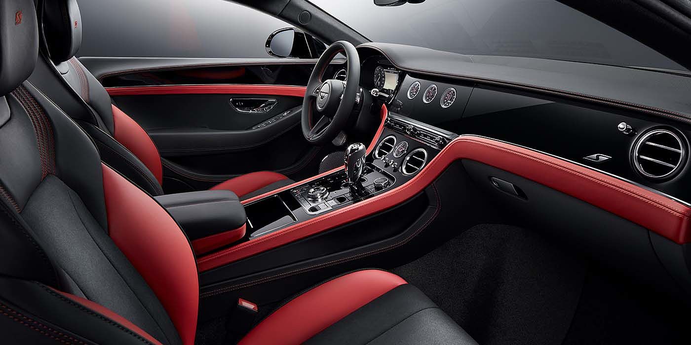 Bentley Warszawa Bentley Continental GT S coupe front interior in Beluga black and Hotspur red hide with high gloss Carbon Fibre veneer
