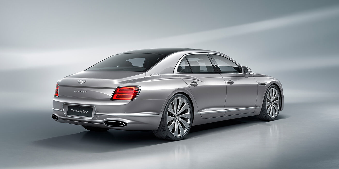 Bentley Warszawa New Bentley Flying Spur sedan rear view in Silverlake paint with ten spoke wheels and chrome matrix grille
