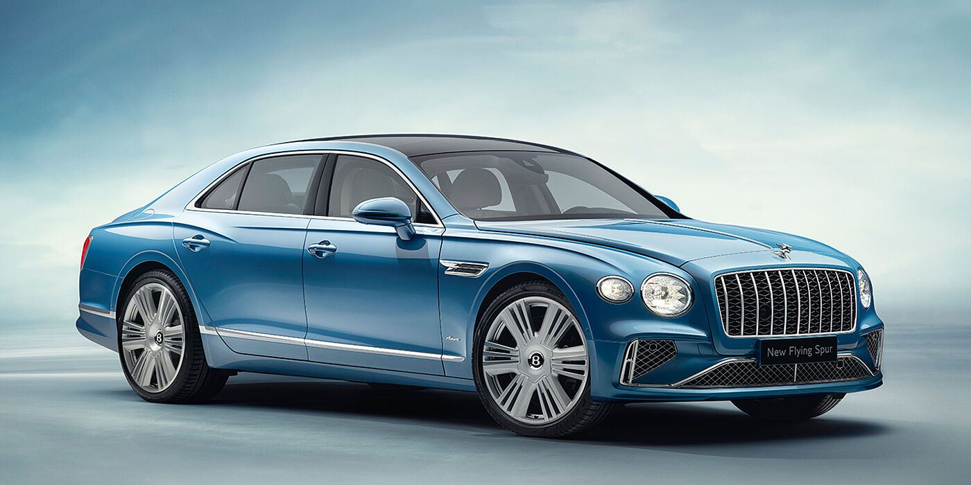 Bentley Warszawa New Bentley Flying Spur Azure sedan front view in Light windsor blue by Mulliner paint with 22 inch Azure wheels and chrome exterior details