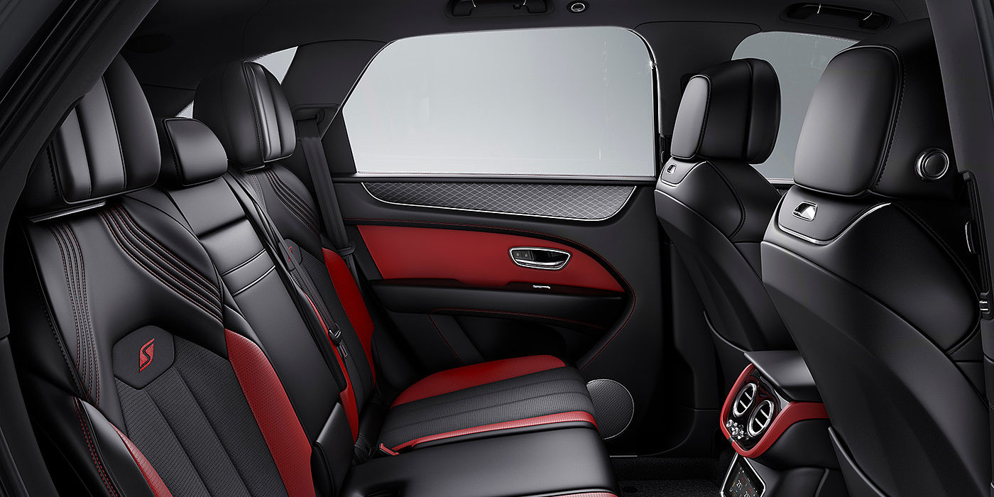 Bentley Warszawa Bentey Bentayga S interior view for rear passengers with Beluga black and Hotspur red coloured hide.