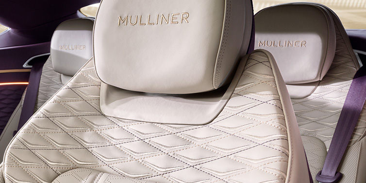 Bentley Warszawa Bentley Continental GT Mulliner coupe seat detail in Linen leather with Mulliner Diamond in Diamond quilting and Mulliner embroidered seat emblem